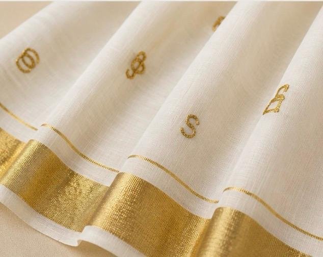 Premium Kerala Kasavu Cotton Saree with Gold Zari Border & Elegant Malayalam Letter Motifs - Image 2