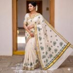 Premium Off-White Kasavu Cotton Silk Saree with Green Peacock Motifs & Golden Zari Border
